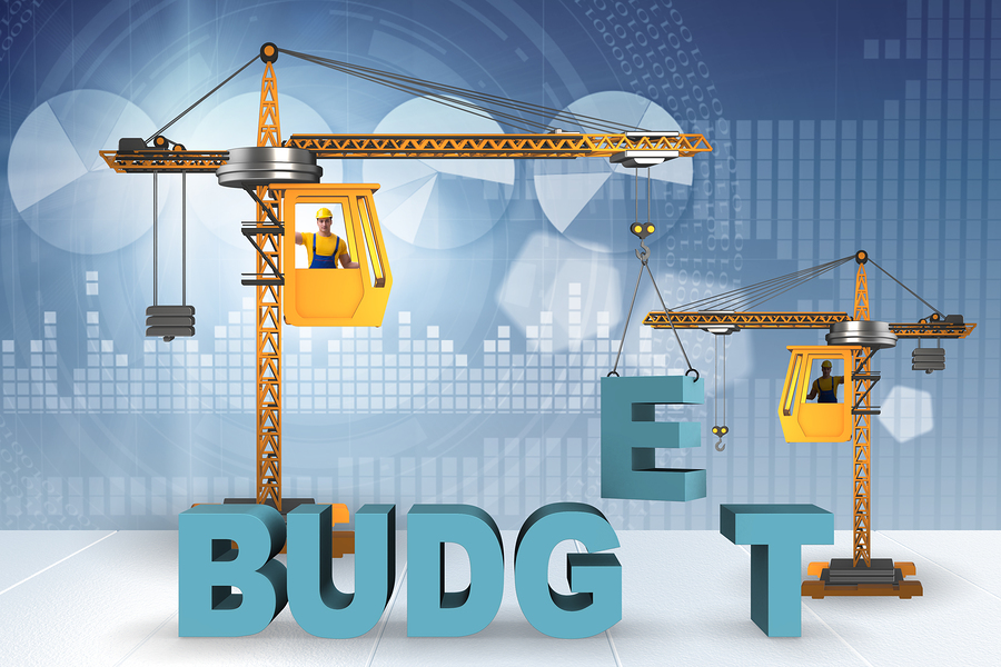 A graphic showing two construction cranes building the word "BUDGET"