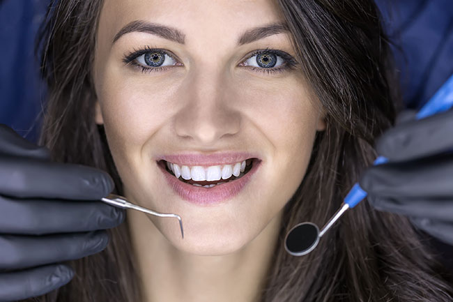 woman getting dental work done is not worried