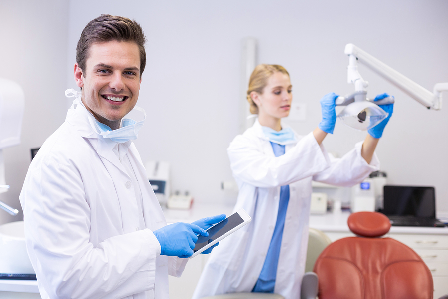 Happy dentist in a newly renovated treatment room.