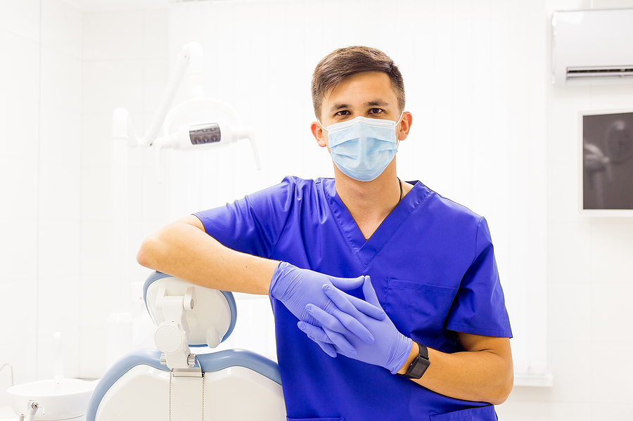 Smiling dentist in his new office.