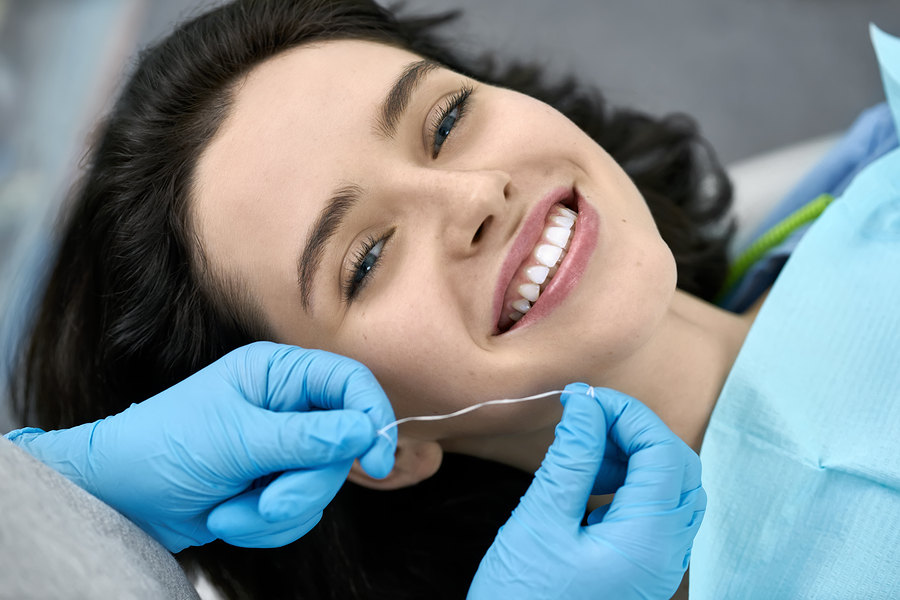 Happy dental patient in a treatment room.