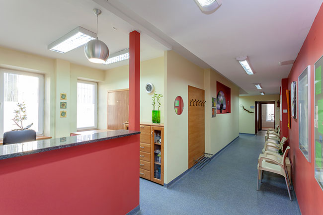 This Dental office design effectively uses space in its waiting area